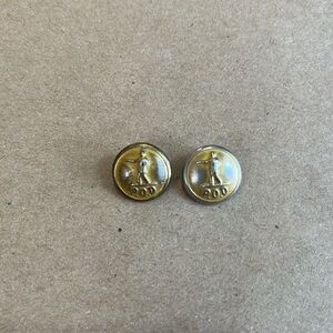 Pair of original buttons off old postal service uniform.